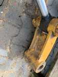 Kiwak łyżki kopiącej do minikoparki CAT 301/  CAT 302
