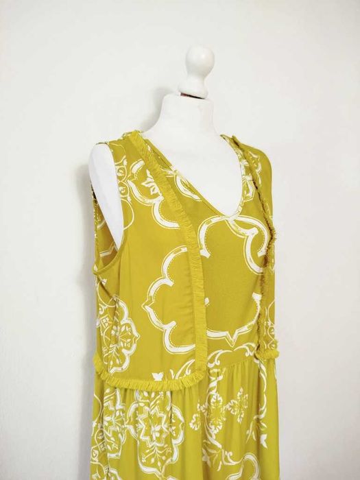 Next limonkowa bluzka z frędzelkami falbanka