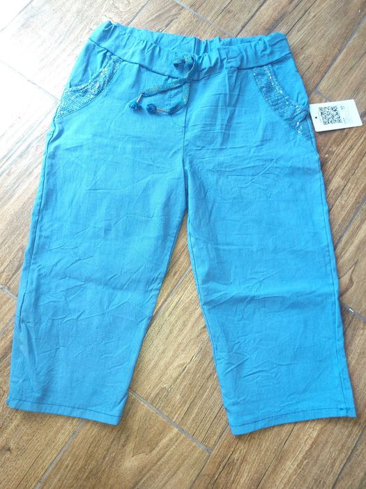 Włoskie Niebieskie Spodnie Rybaczki 3/4 elastyczne z cekinami Nowe r L