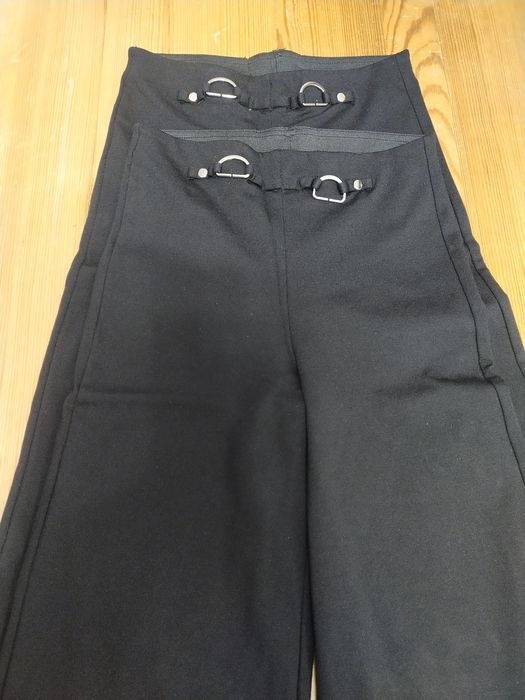 Dwie pary spodnie świąteczne czarne rozszerzane Mayoral 140