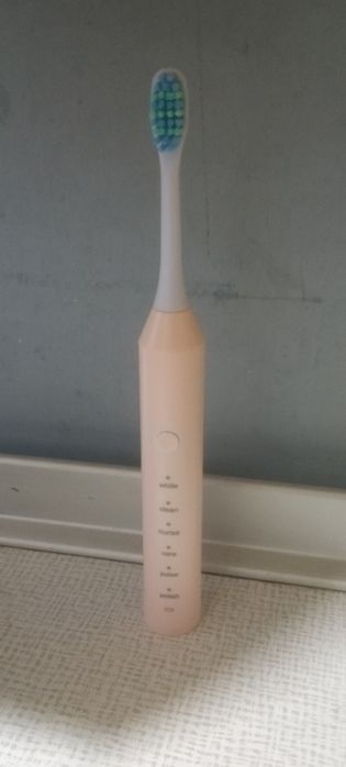 Электрическая зубная щётка