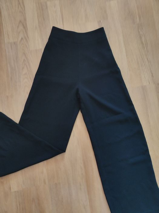 Чорні легкі підліткові брюки розкльошені донизу