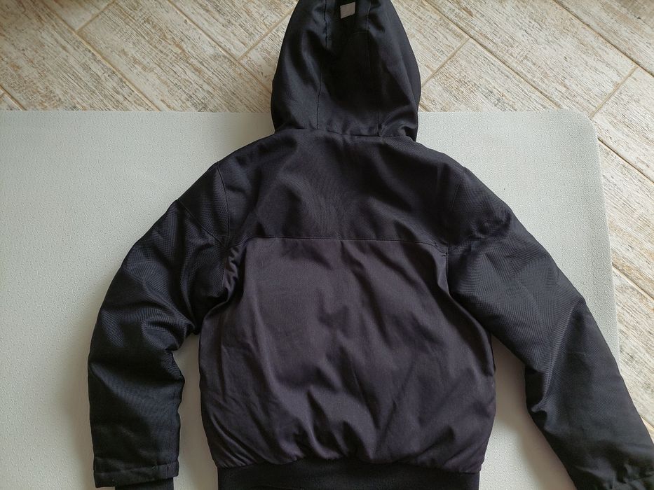 Тепла куртка next