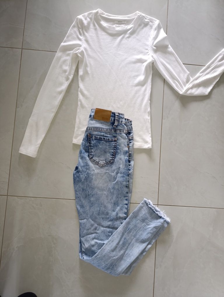 Spodnie jeansy damskie dziury jeans niebieskie błękitne dziury S 36