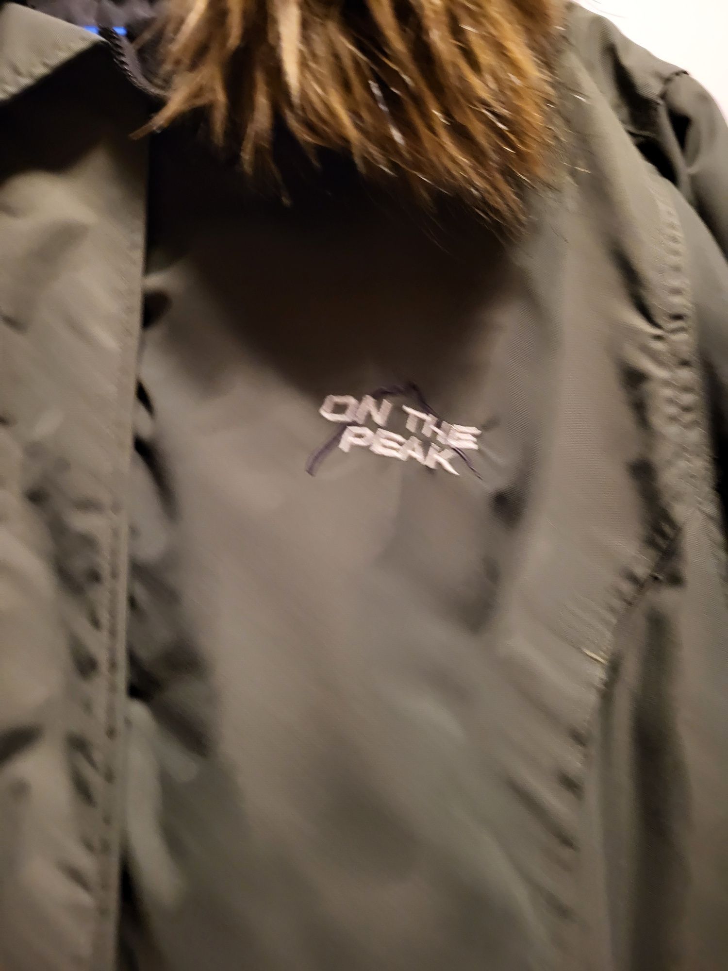 Khaki parka On The Peak