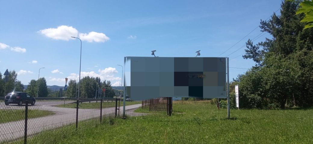 Tablica reklamowa przy "Zakopiance"