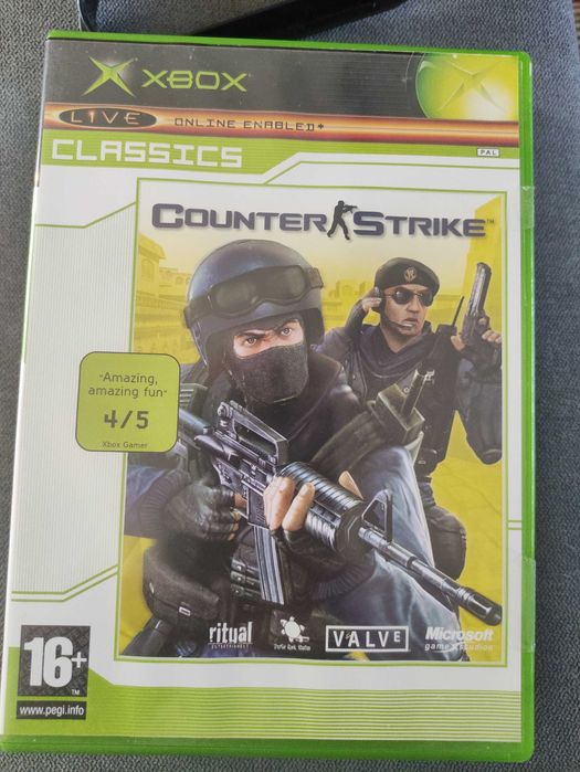 Vendo x box com dois comandos e 21 jogos.