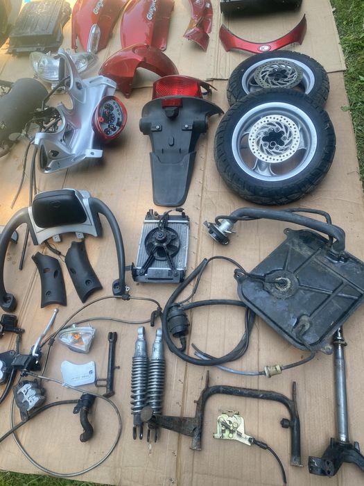 Kymco Grandink 125 owiewka licznik lampa koło zacisk amortyzator bak