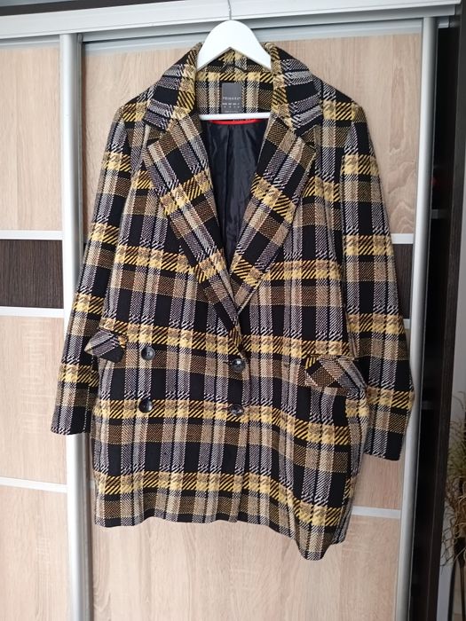 Жіночий фірмовий піджак.