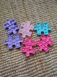 Puzzle Push poppers