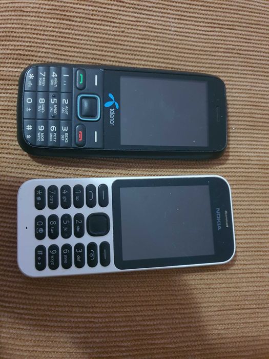 2 telemóveis com teclas Nokia e outro