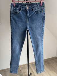 Elastyczne jeansy rurki George r.40