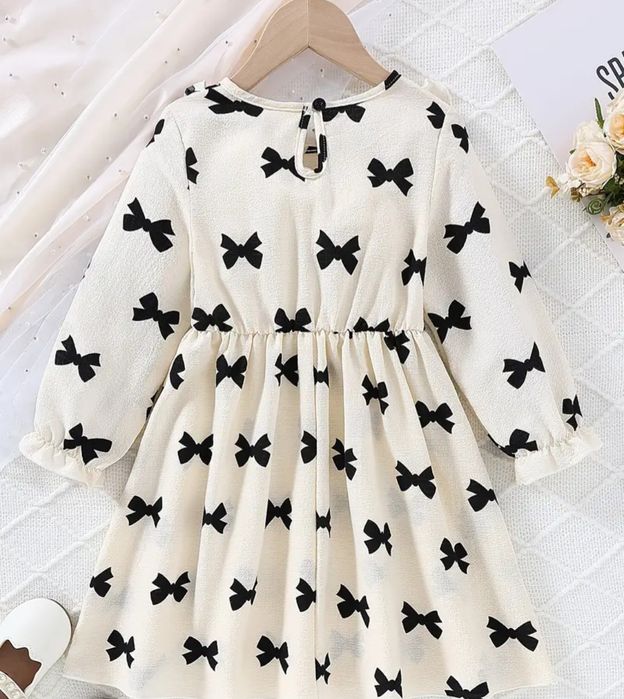 Nowa sukienka 116 elegancka w kokardki beżowa kremowa