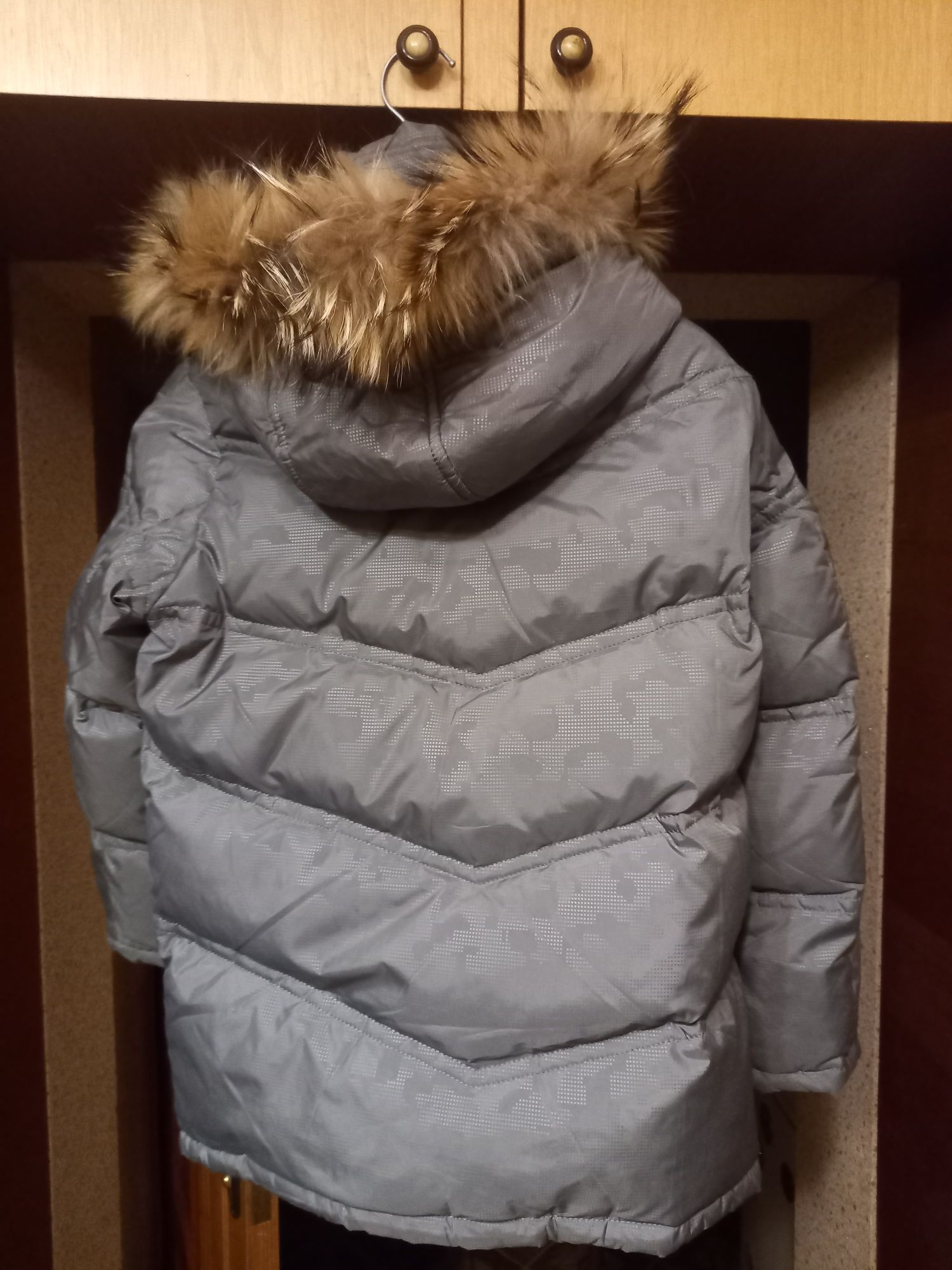 Зимова пухова куртка
