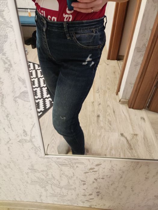 Damskie spodnie dżinsowe z przetarciem