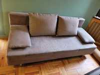 Rozkładana szara sofa