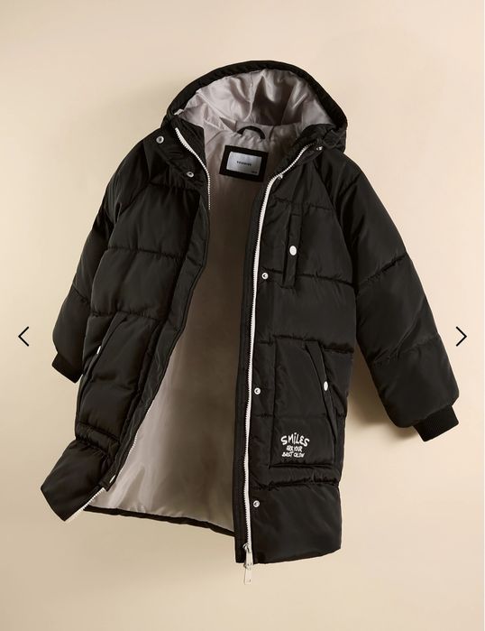 Зимове довге стьобане пальто з капюшоном