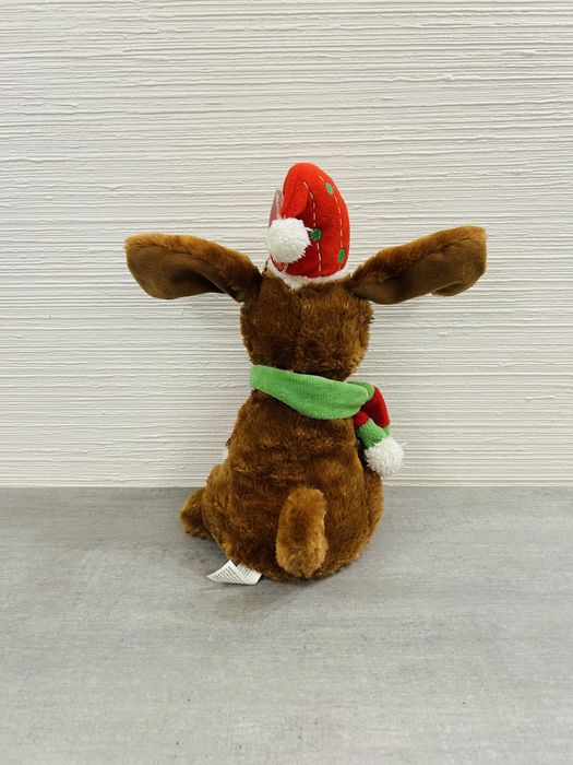 Інтерактивна різдвяна собачка. Співає пісні та шевелить вухами.