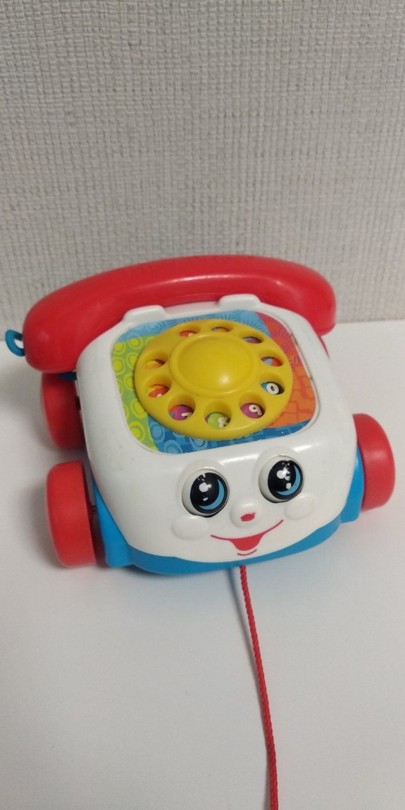 Fisher price телефон каталка, рухає очима