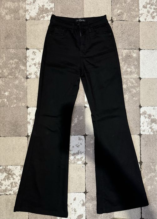 Джинси чорні кльош