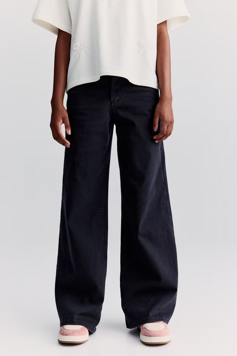 Czarne szerokie spodnie jeans dla dziewczynki H&M