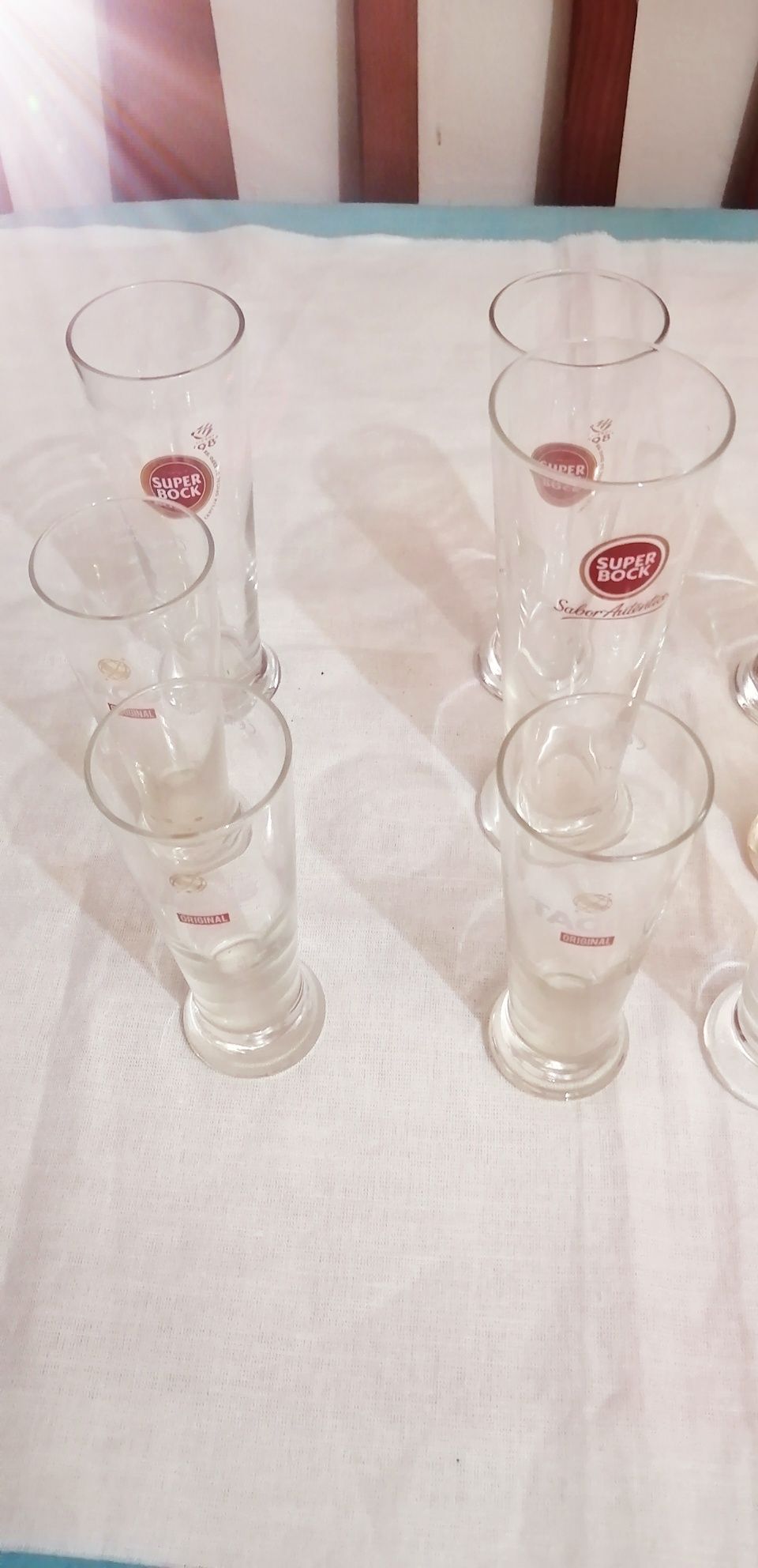 9 copos de cerveja super bock ler discrição.