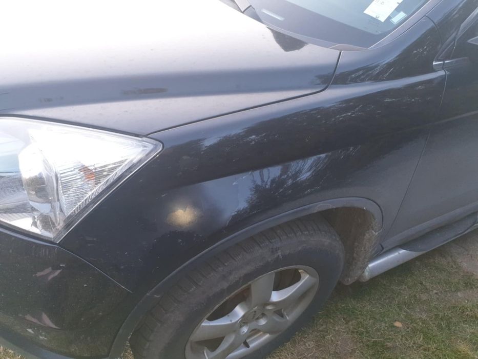 Blotnik lewy przód Honda Crv 3 oryginalny