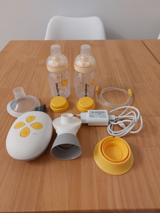 Bomba eléctrica e 2 biberons Medela