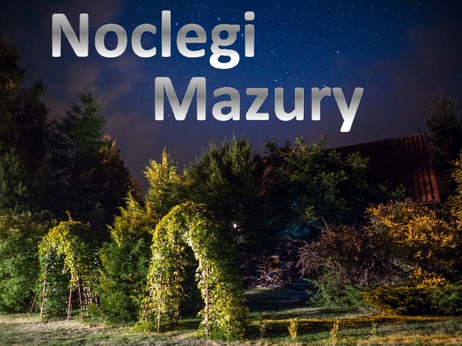 WAKACJE MAZURY noclegi Chata w Puszczy nad jeziorem domki Mazury