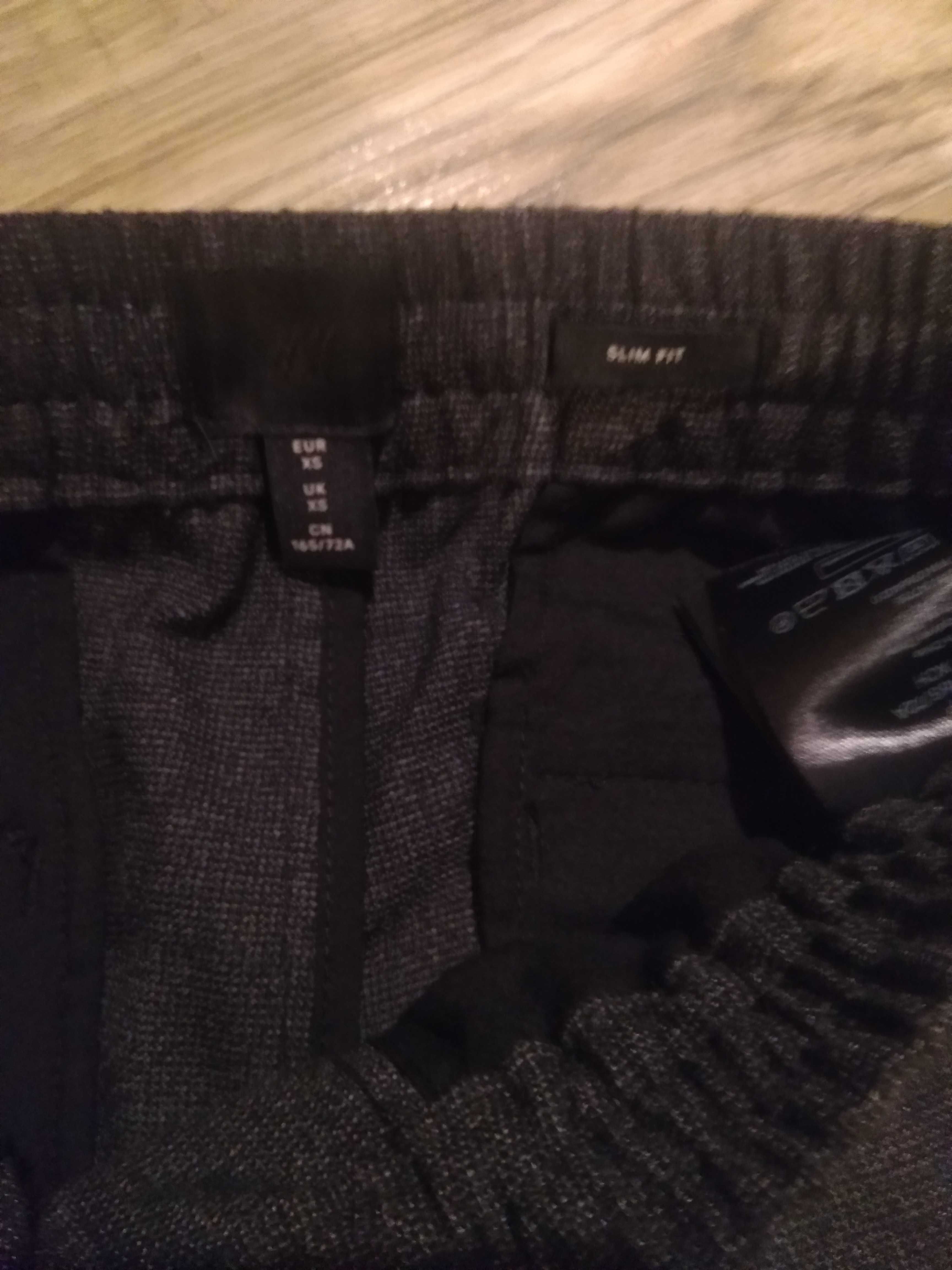 Męskie młodzieżowe eleganckie joggersy slim fit H&M rozm. XS