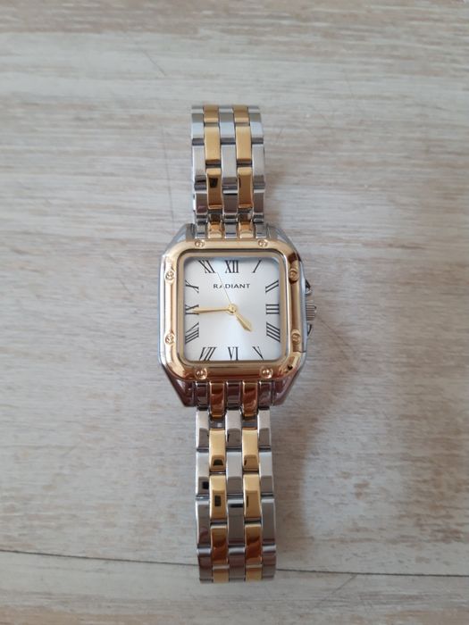 Relógio prateado e dourado Radiant