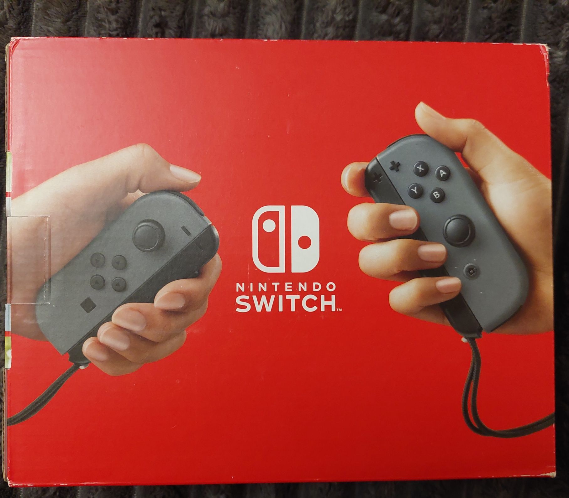 Nintendo Switch with gray Joy con