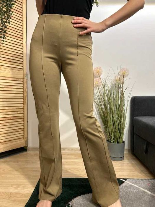 Damskie beżowe elastyczne spodnie rozszerzane KappAhl