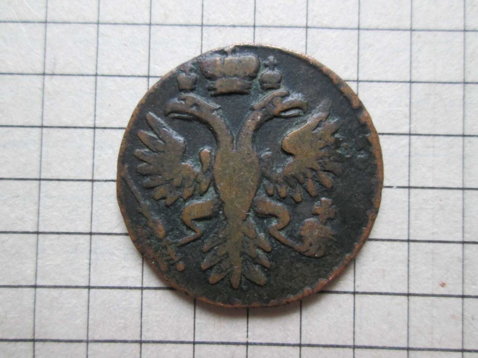 Монета Денга перечекан с поворотом