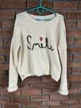Kremowy sweter New look z napisem Smile