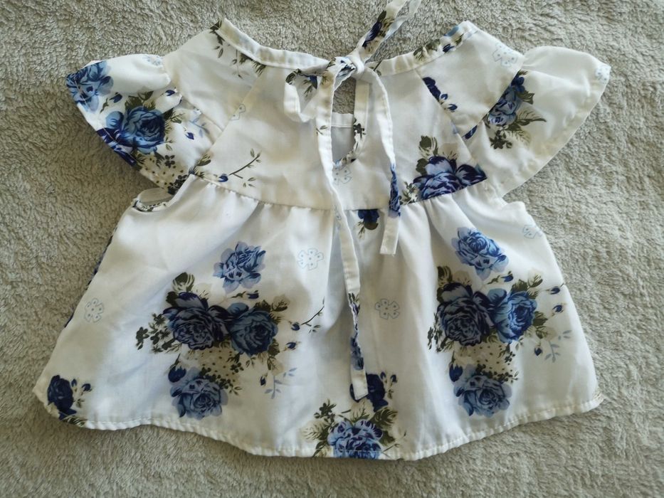 Biała elegancka zwiewna wiązana bluzka w kwiatki 68 - 74 jak nowa