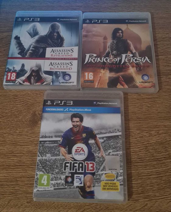 Consola PlayStation 3 c/comando e jogos usada