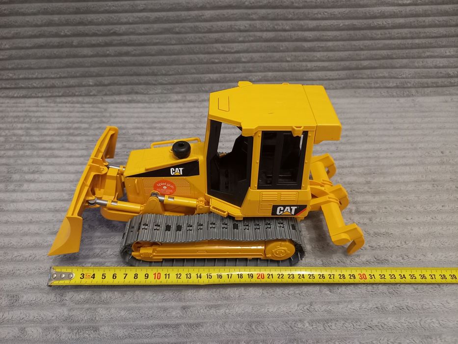 Гусеничний трактор бульдозер CAT від Bruder