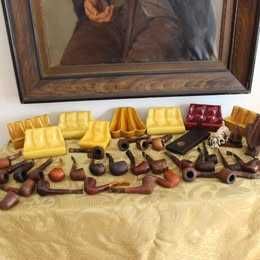 Colecção de cachimbos e suportes para venda .