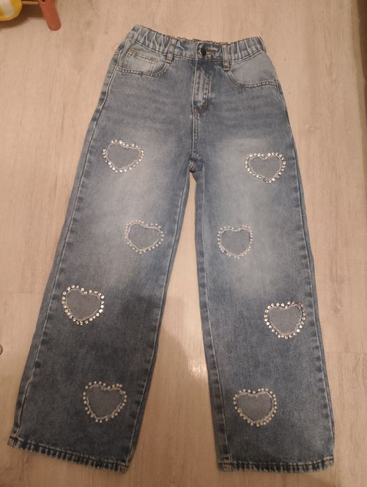Jeansy z dziurami rozmiar 140