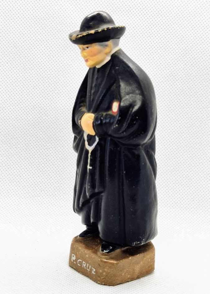 Estatueta religiosa em cerâmica representando Padre Cruz