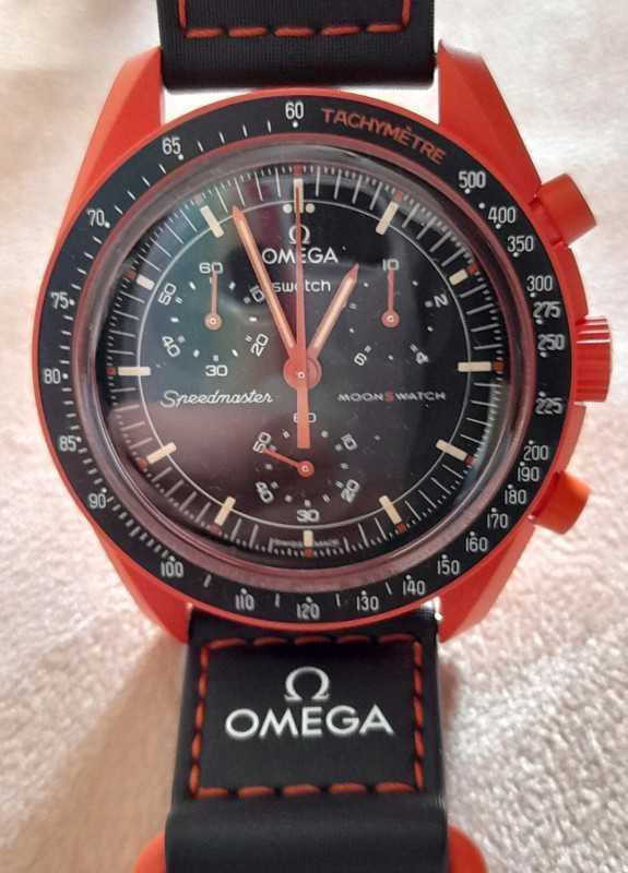 Omega Swatch SO33O100 Lava Archiwum Ziemi