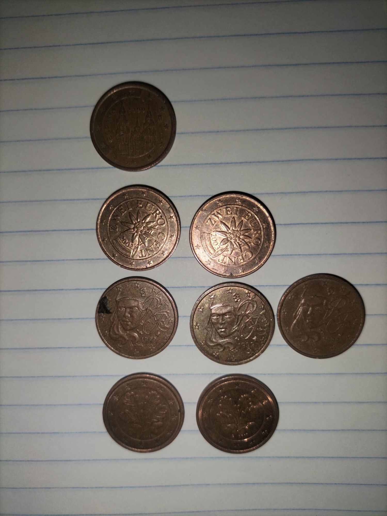 Moedas de 5, 2 e 1 cêntimo.