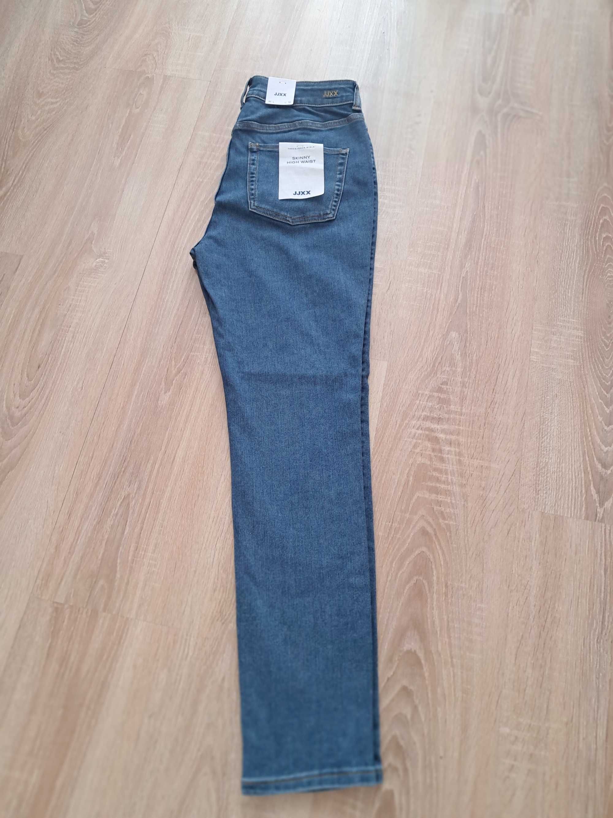 Spodnie jeansowe  Nowe z Metką.80cm pas