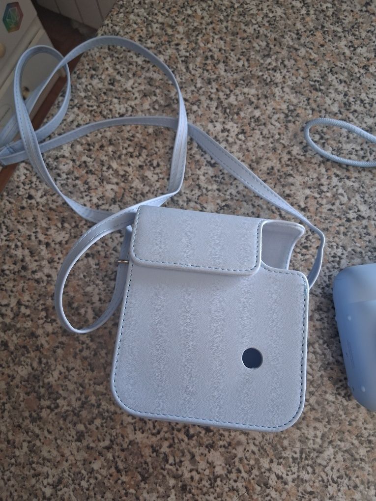 Máquina fotográfica instantânea