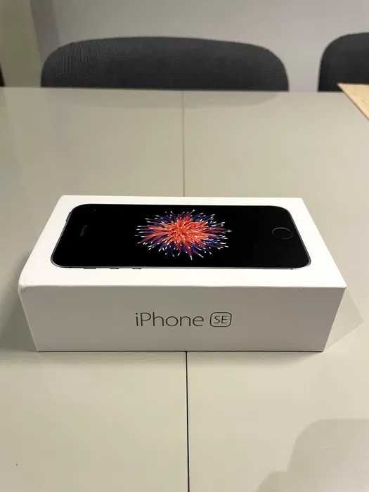 iPhone 5 SE with case and box