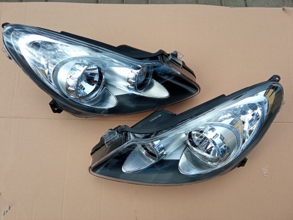 OPEL CORSA D 2006 - lampa przednia lewa + prawa nowe