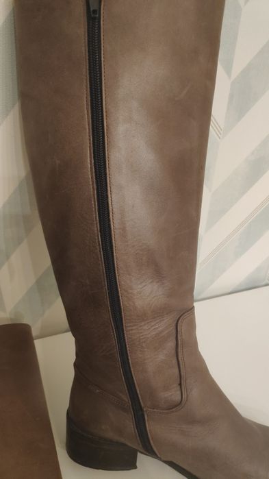 Botas cano alto em pele