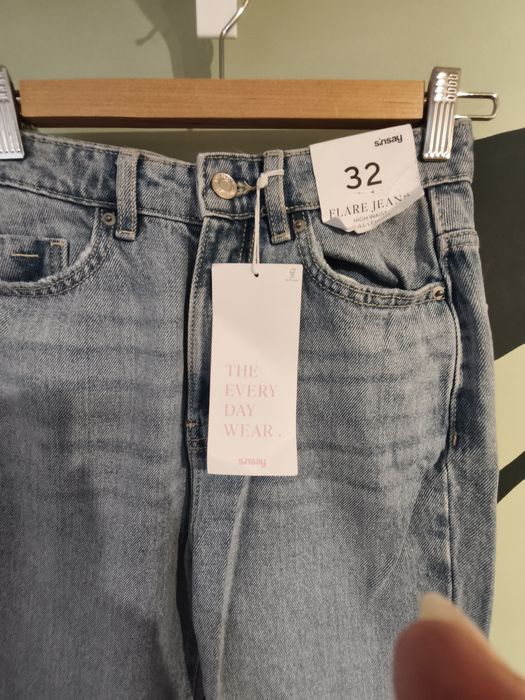 Sinsay jeansy flare z dziurami 32 nowe