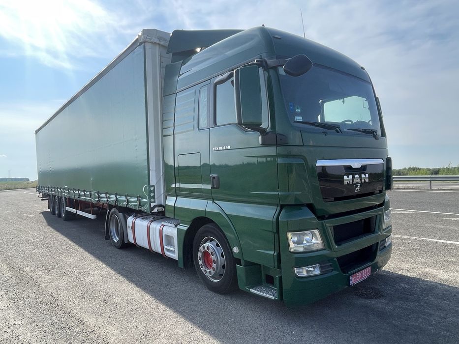 Тягач Man TGX 18.440 MEGA + напівпричіп штора Kassbohrer осі SAF